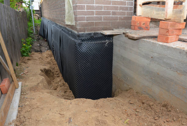 Happy homeowners after waterproofing job in Westover